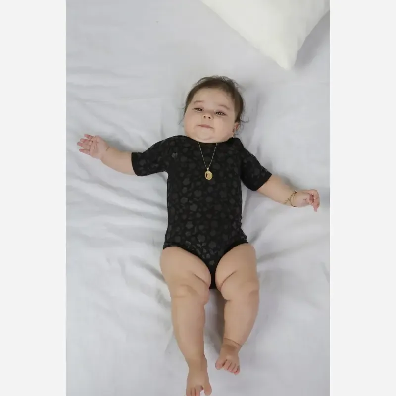 بادی نوزادی زیر دکمه دار مشکی تمام نخ پنبه طرح دار - تصویر 2